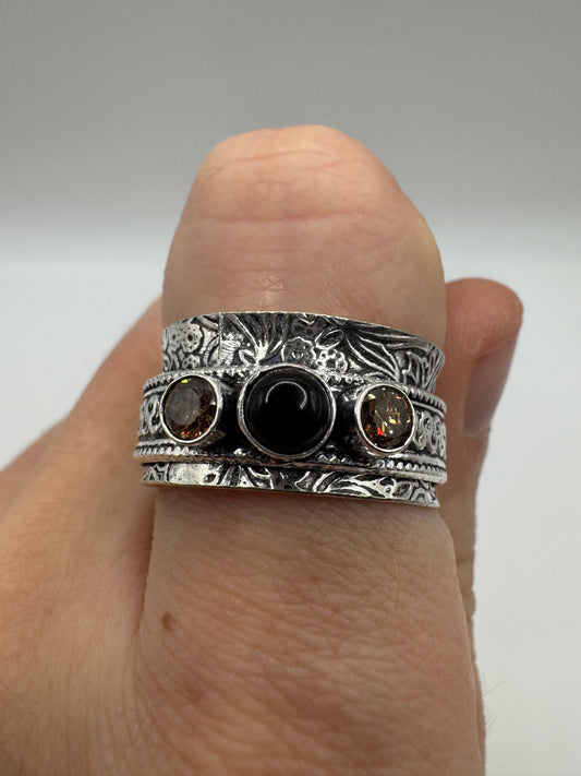 Silver onyx and topaz ring