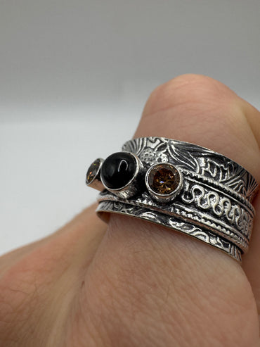 Silver onyx and topaz ring