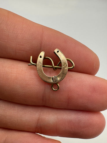 9ct gold horseshoe and cane pendant