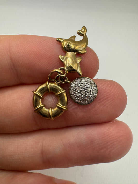 9ct gold diamond dolphin, disc and life raft pendant