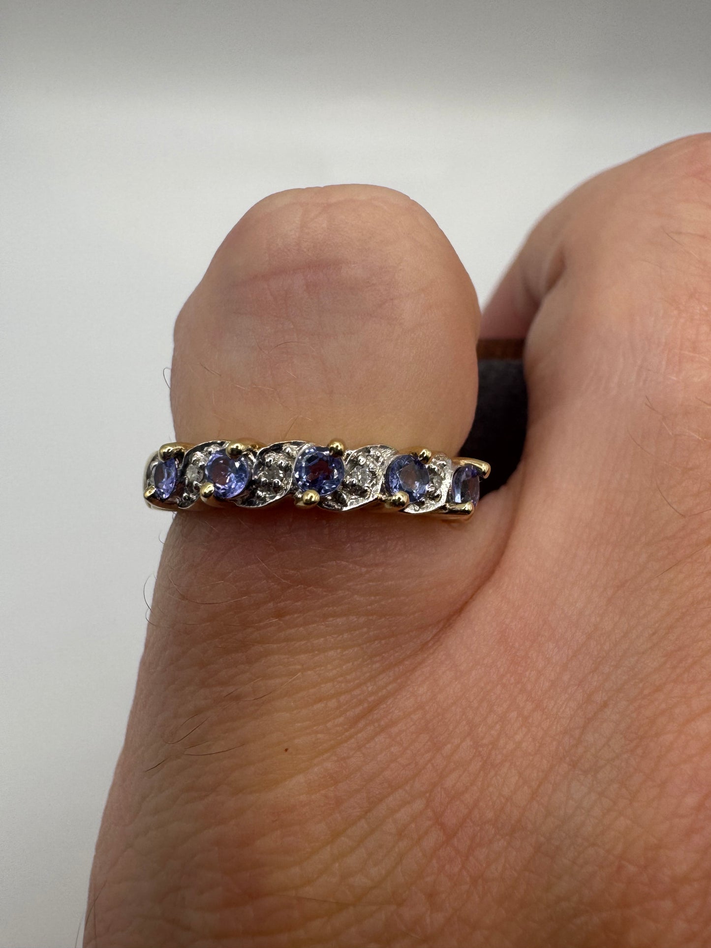 9ct gold tanzanite and diamond half eternity ring