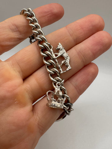 Silver charm bracelet including silver padlock