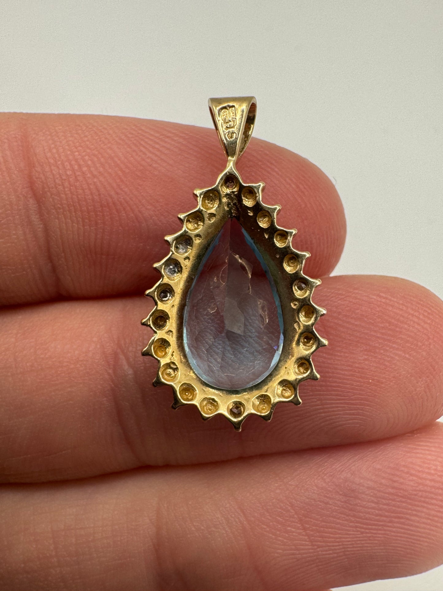 9ct gold topaz and diamond pendant