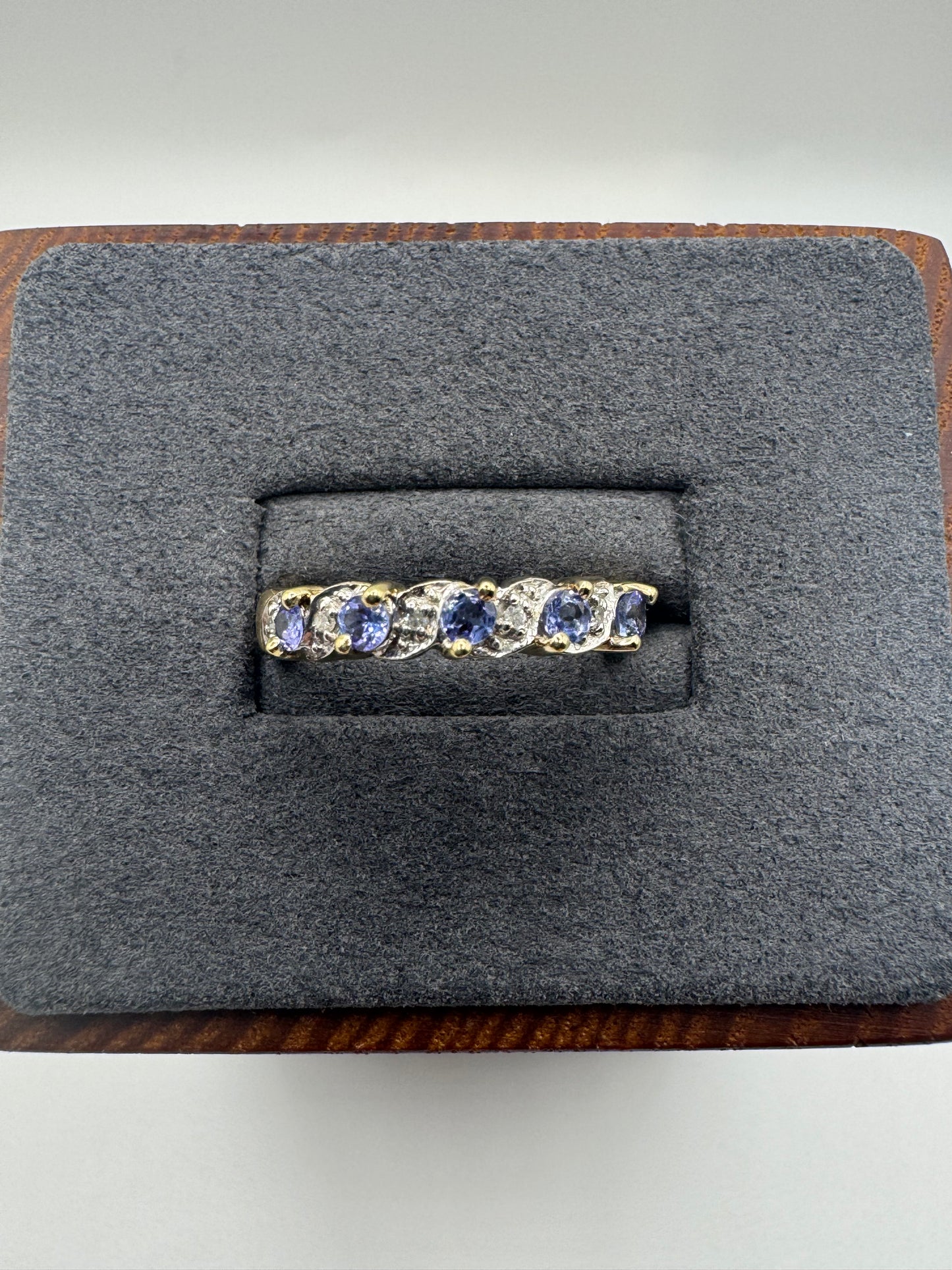 9ct gold tanzanite and diamond half eternity ring
