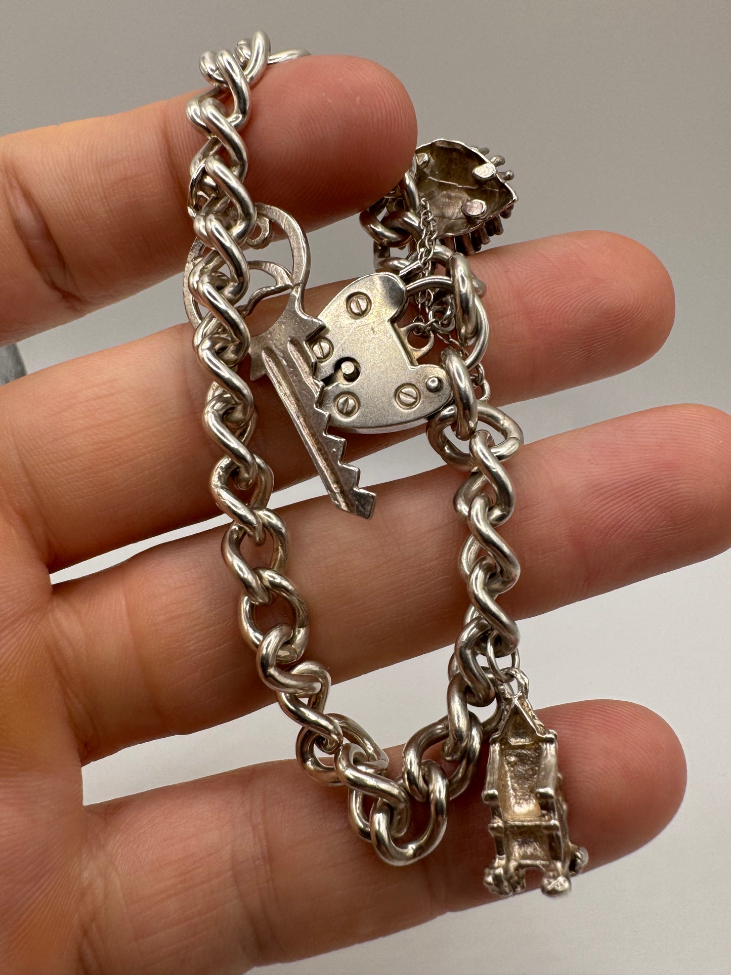 Silver padlock and charm bracelet