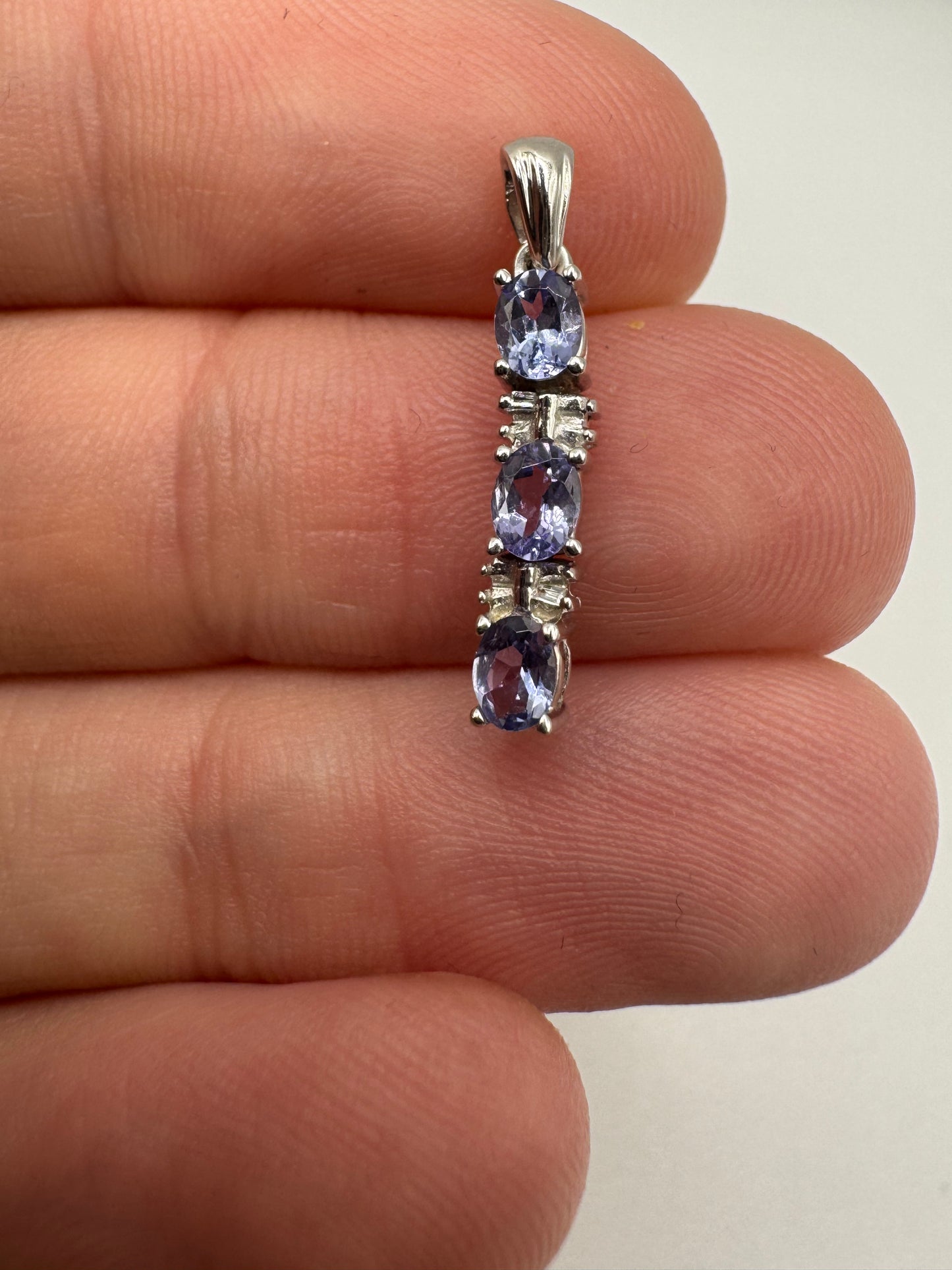 9ct white gold tanzanite and diamond pendant