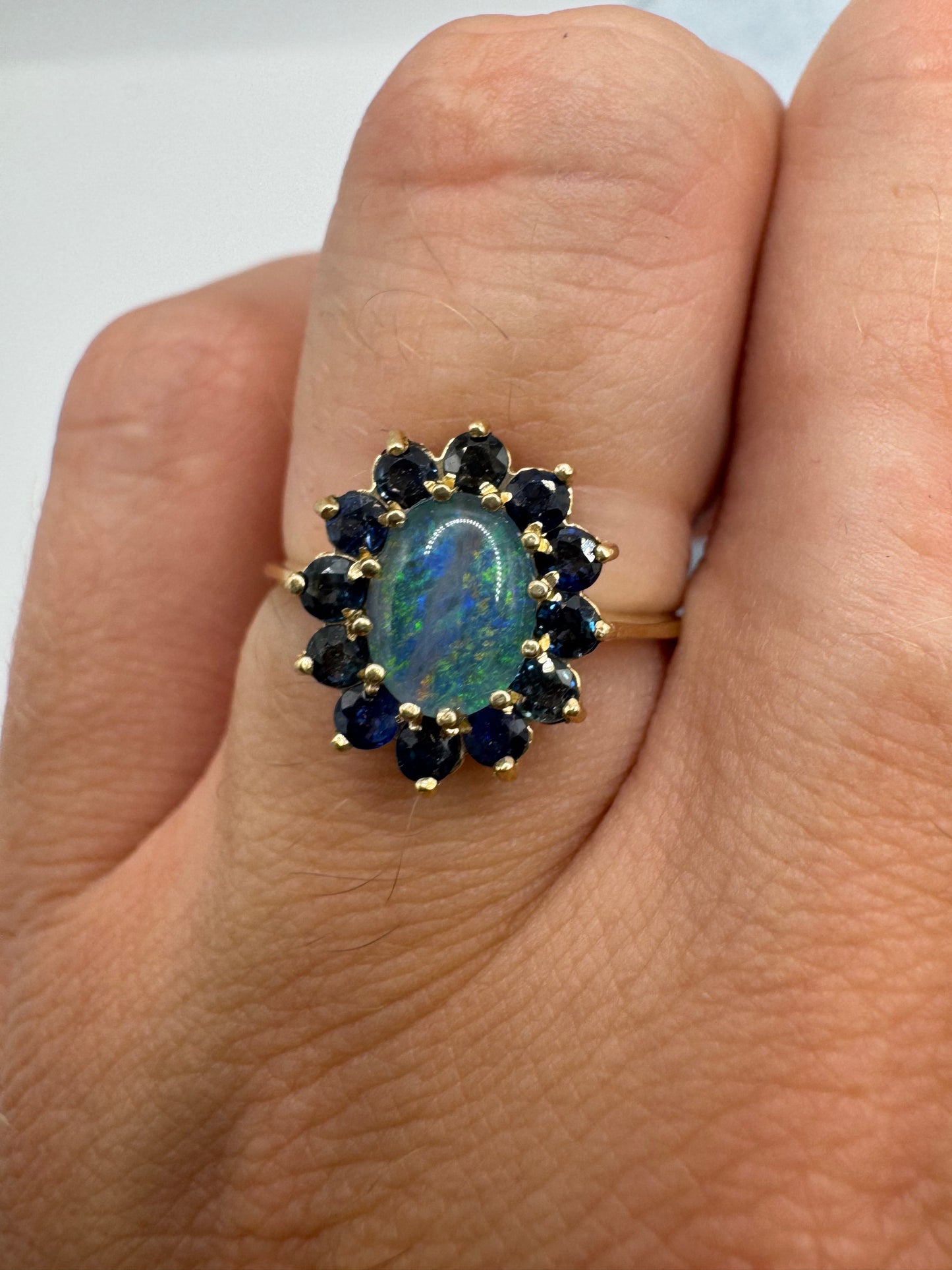 9ct gold black opal triplet and sapphire cluster ring