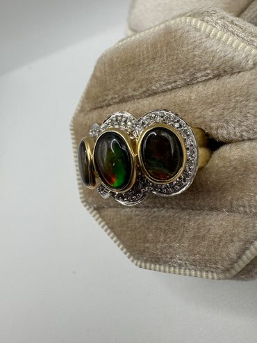 Heavy 9ct gold ammolite and diamond ring