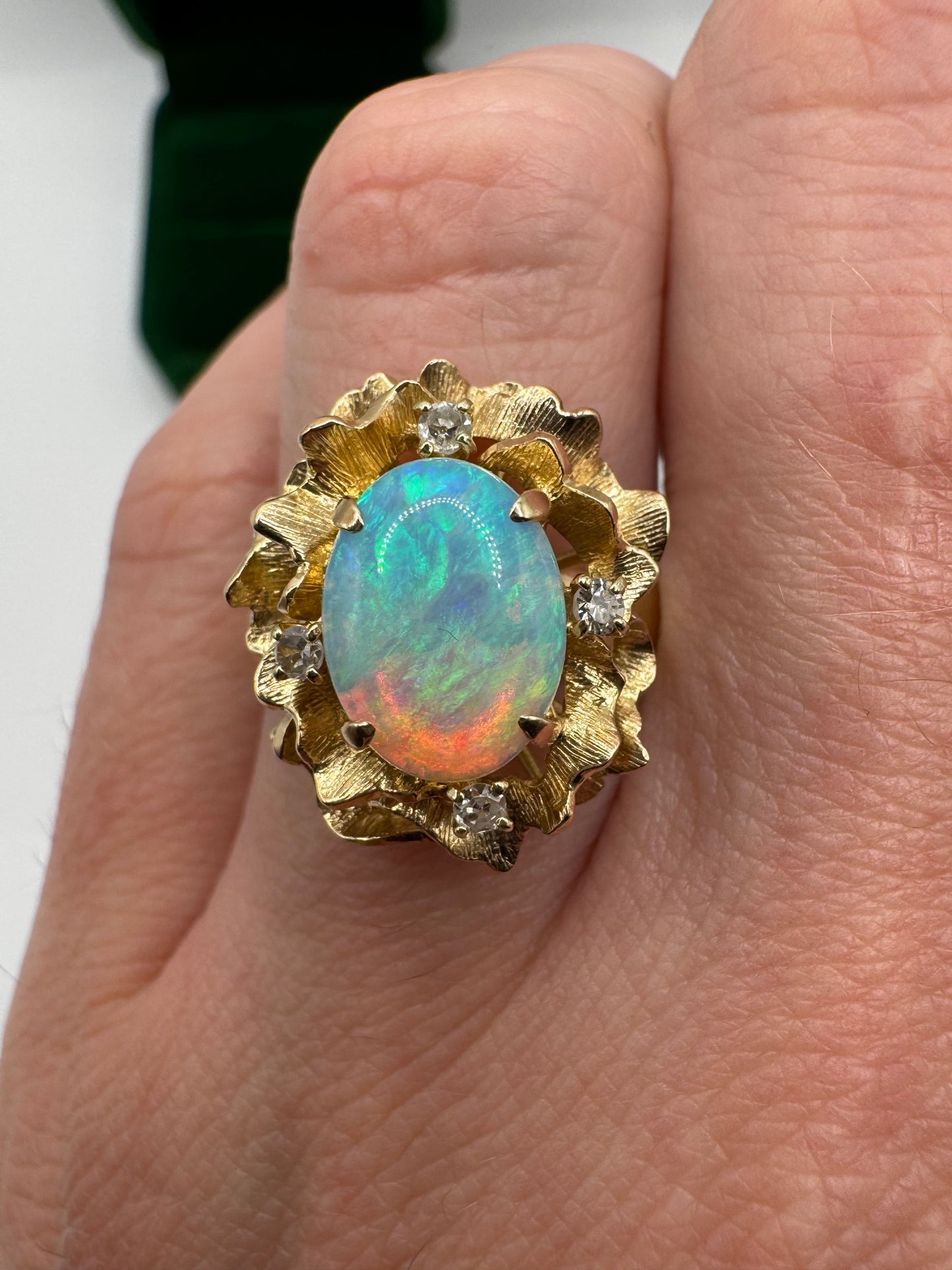 Heavy 9ct gold opal and diamond flower ring