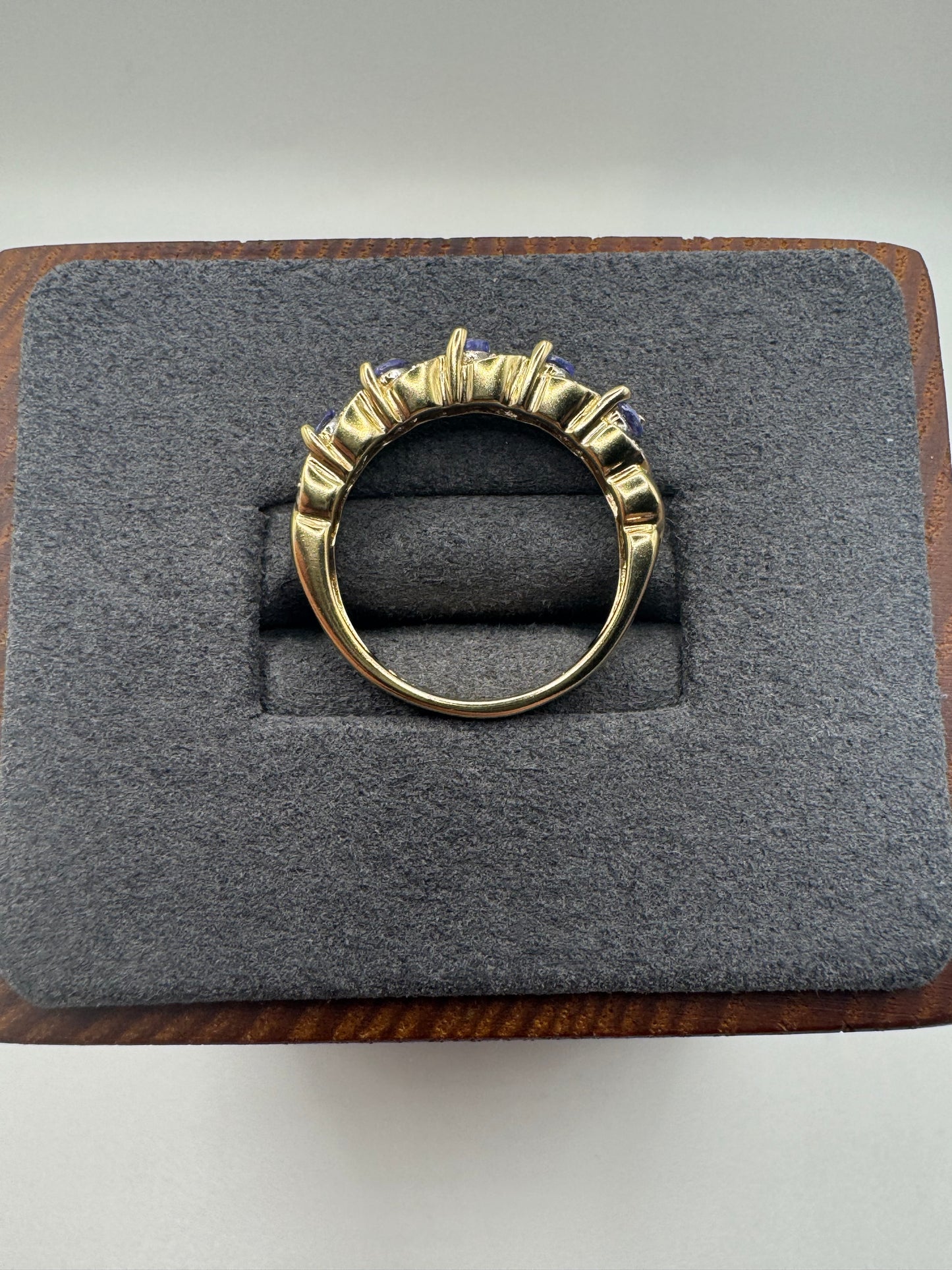 9ct gold tanzanite and diamond half eternity ring