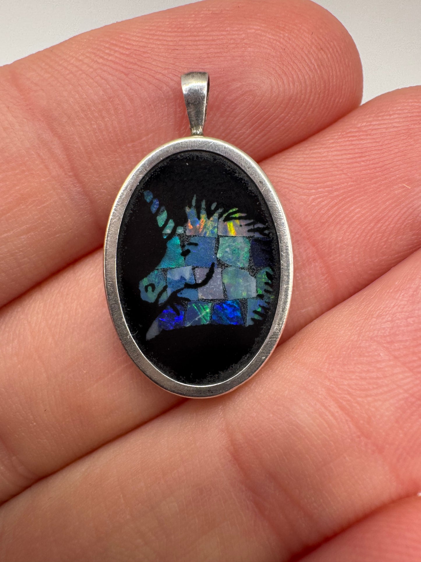 Silver onyx and black opal inlay unicorn pendant