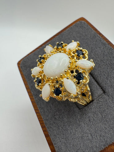 Heavy 9ct gold opal and sapphire ring