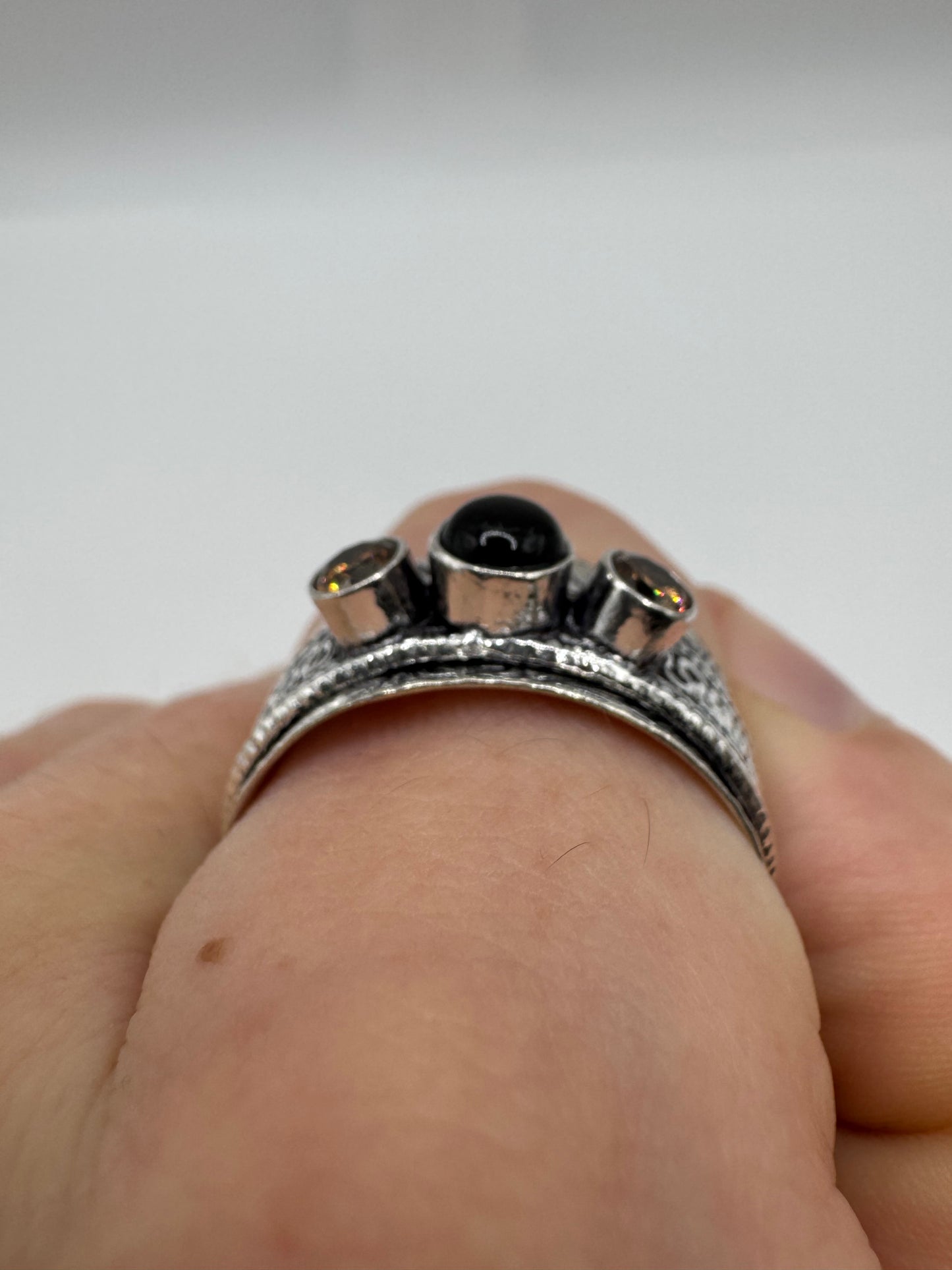 Silver onyx and topaz ring