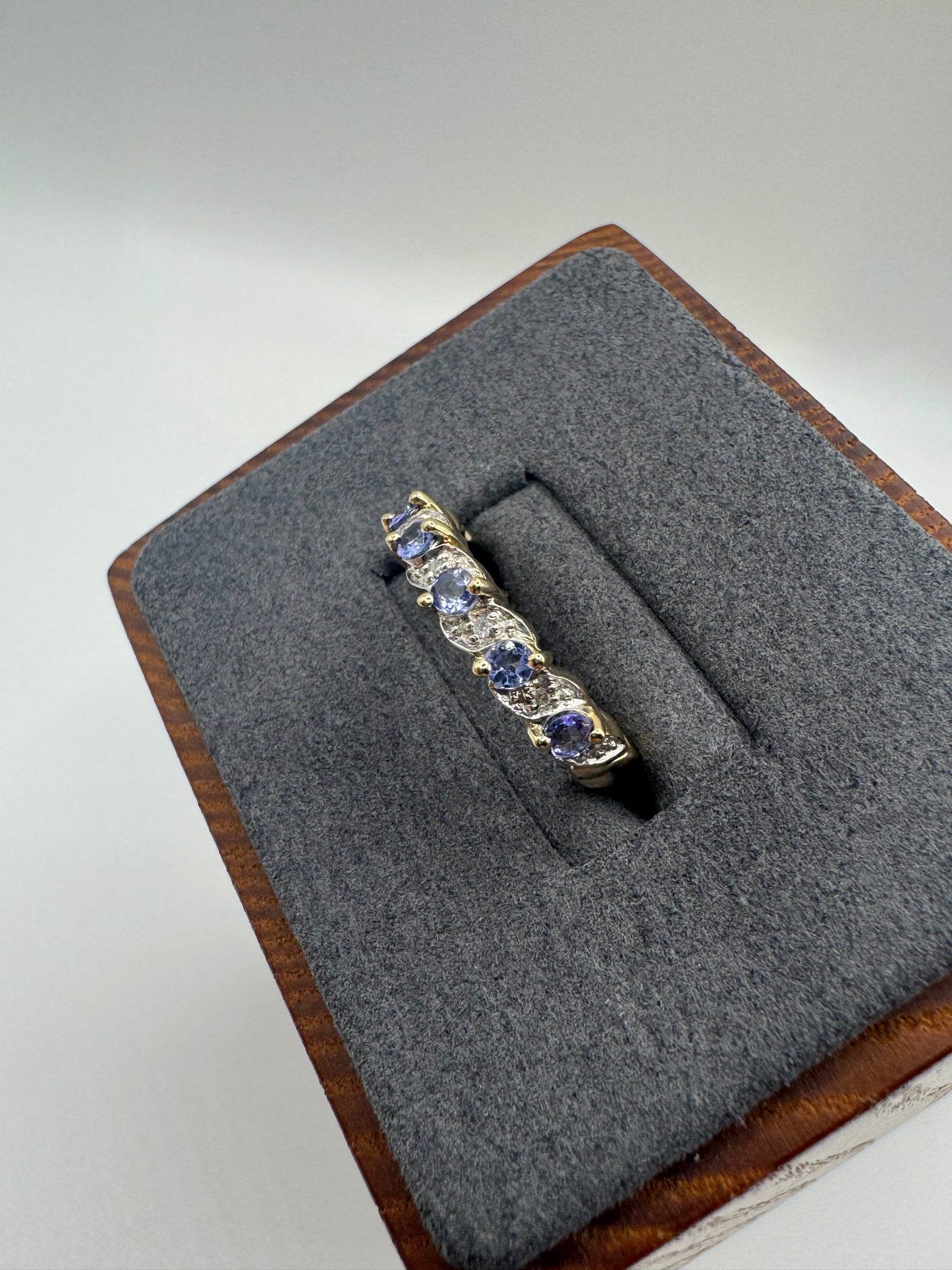 9ct gold tanzanite and diamond half eternity ring