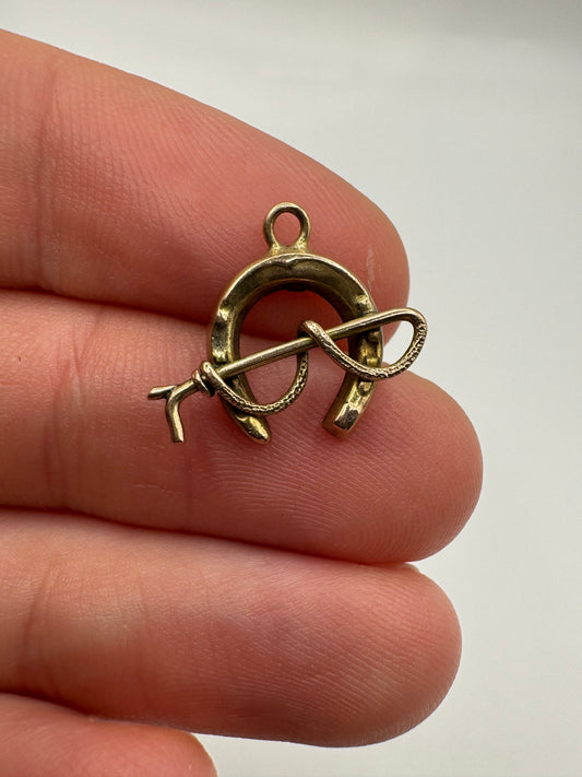 9ct gold horseshoe and cane pendant