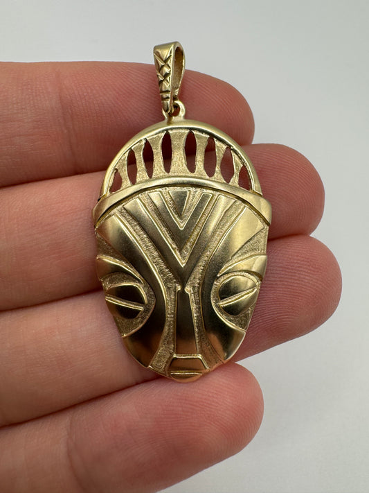 Heavy 9ct gold tribal style mask pendant