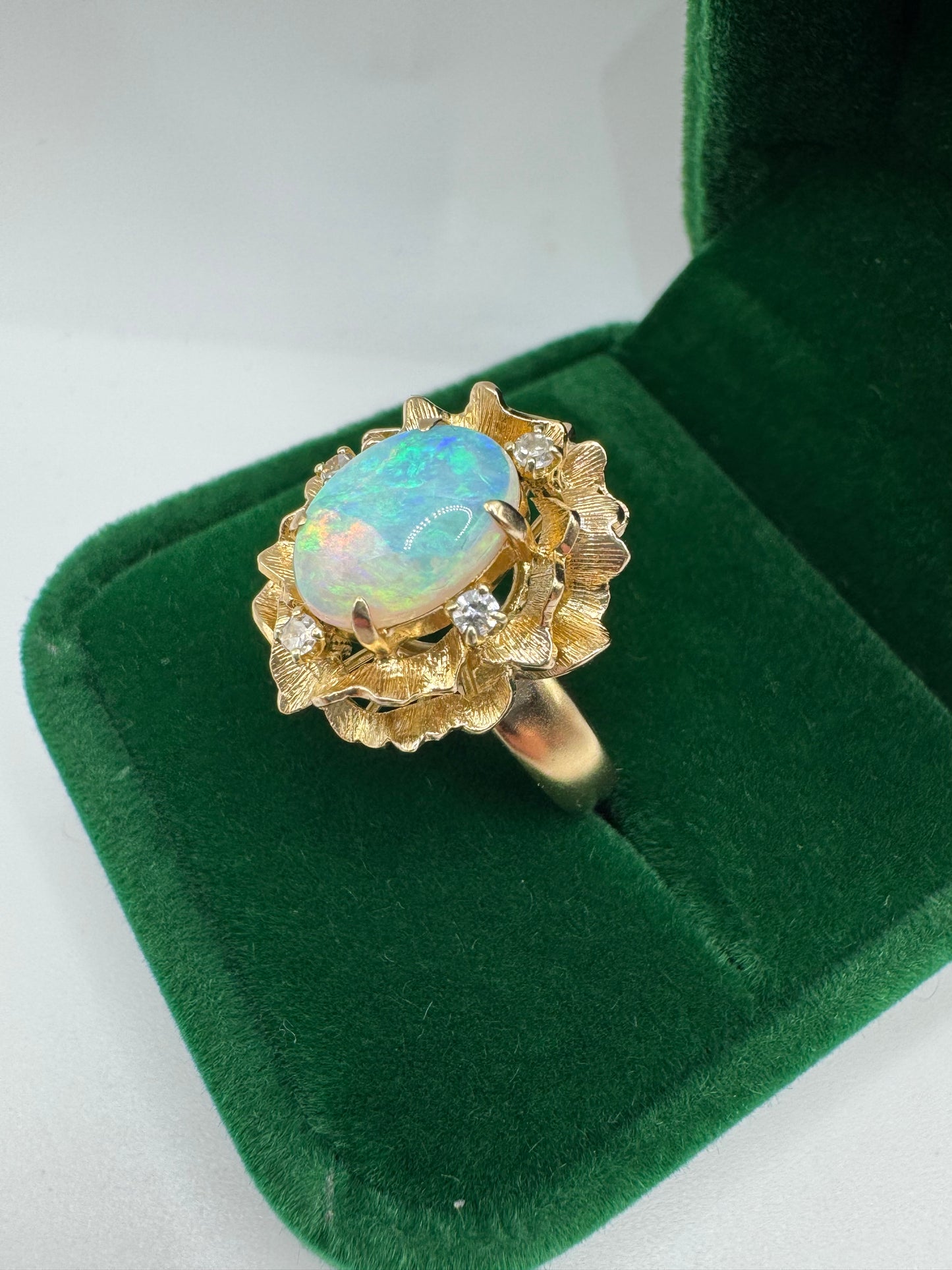 Heavy 9ct gold opal and diamond flower ring