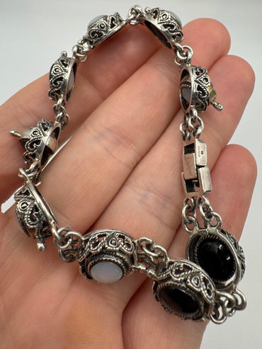 Silver moonstone and onyx reversible bracelet