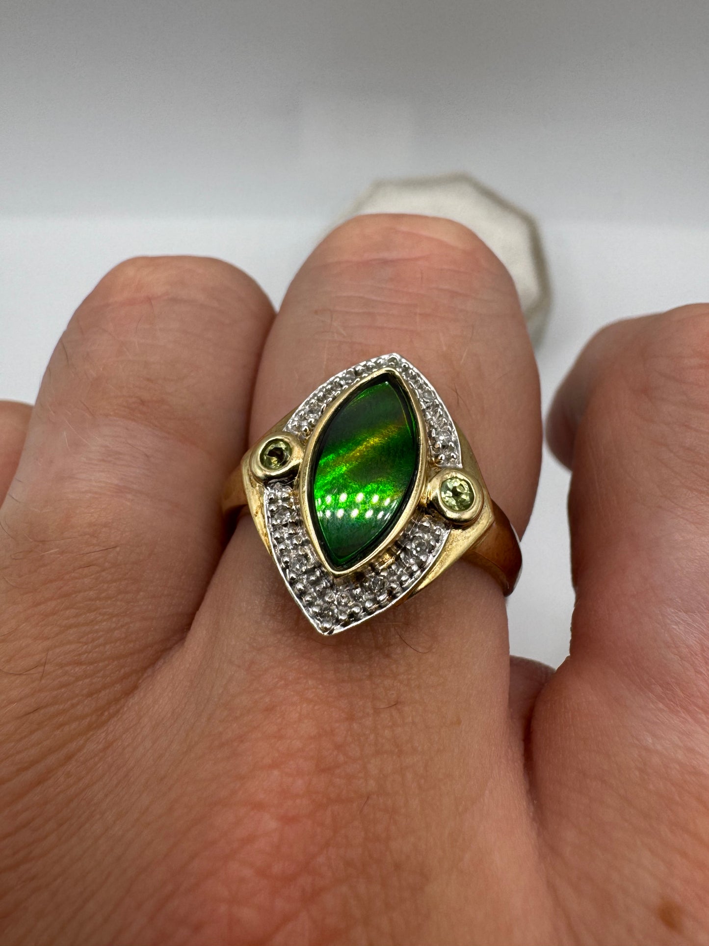 9ct gold ammolite, peridot and diamond ring
