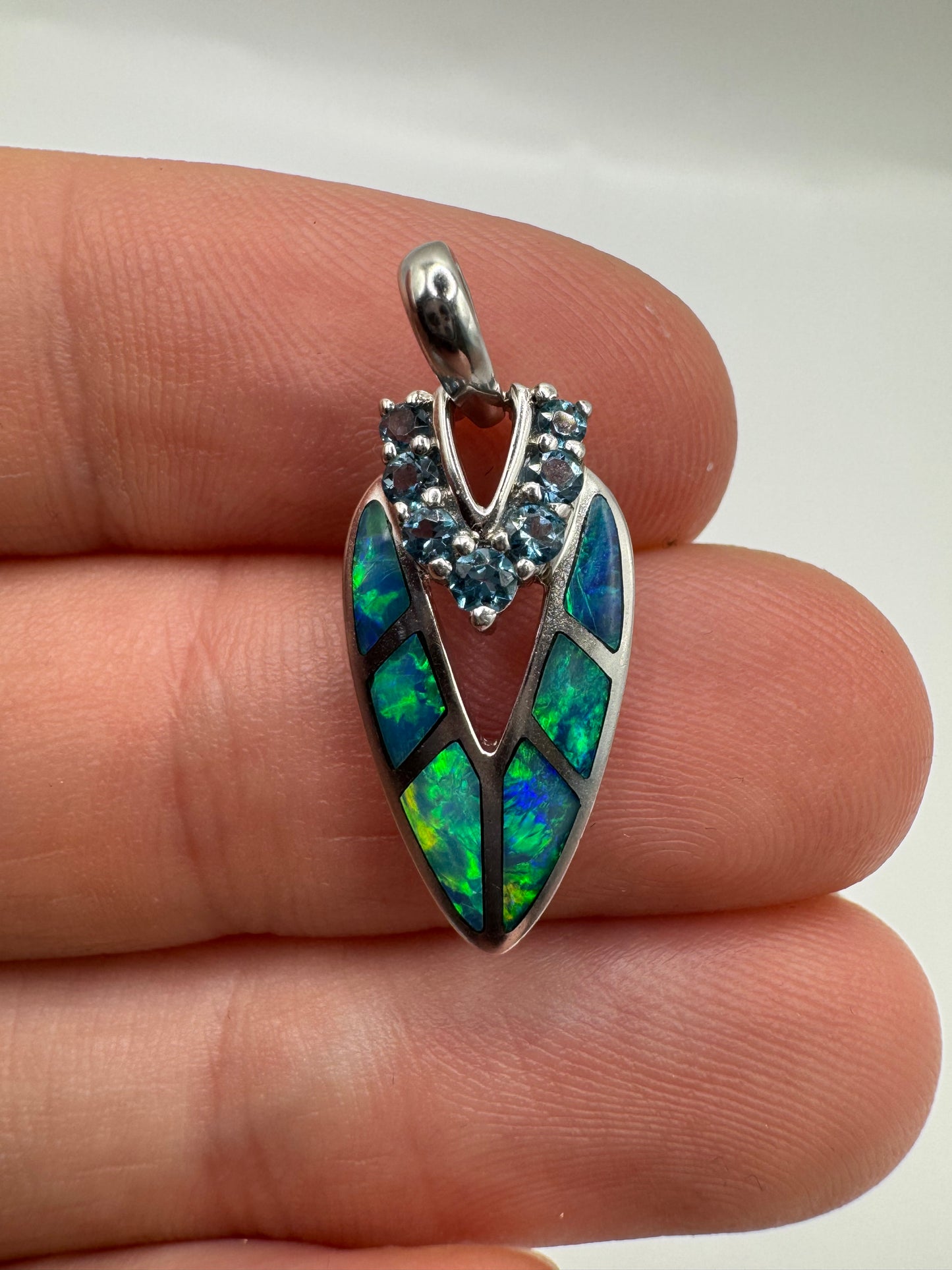 9ct white gold black opal and topaz pendant