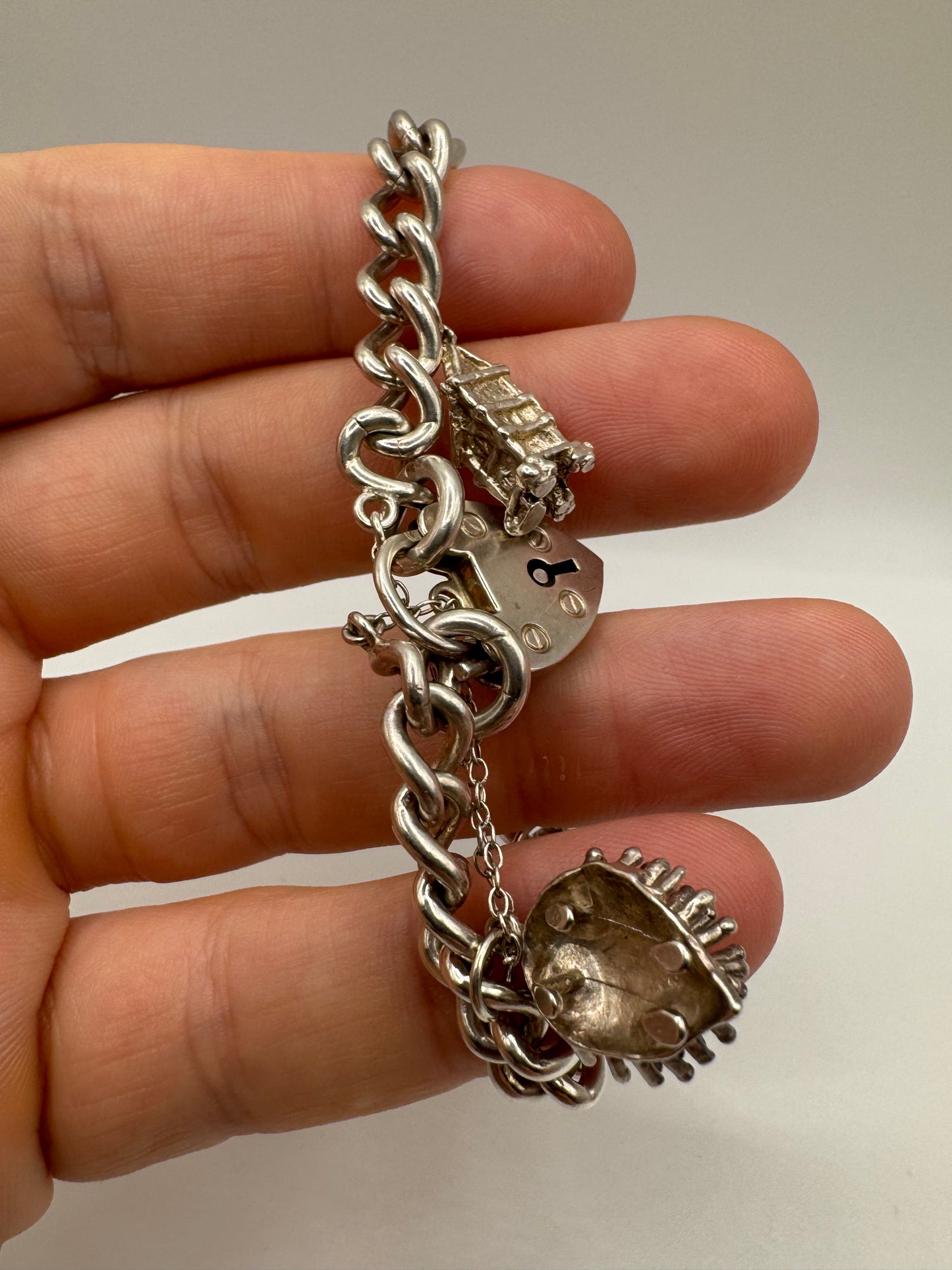 Silver padlock and charm bracelet