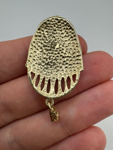 Heavy 9ct gold tribal style mask pendant
